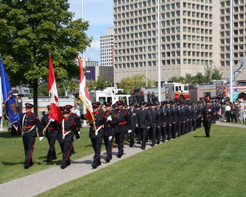 All Uniformed Firefighters step for March Past under orders from Parade Commander John Sobey